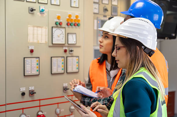 istock Team of Engineers and Technicians Monitoring Control Panel in Modern Renewable Energy Facility 2249707926