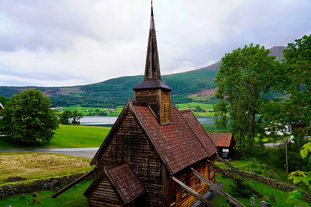 istock Old wooden church in a lush valley 2249708111