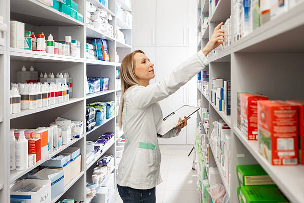istock Medical Specialist Conducting Inventory Control in Pharmacy Aisle 2249708793