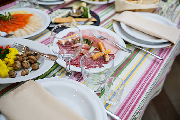 istock Table in the restaurant, dishes in white plates, festive banquet 2249709486