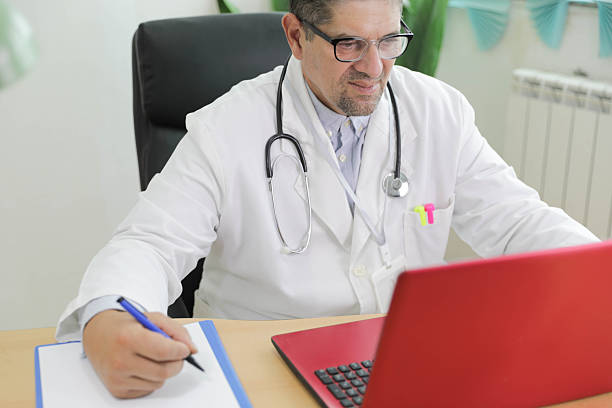 istock Senior Doctor Taking Notes During Online Telemedicine Consultation 2249709708