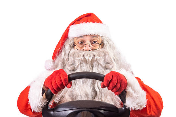 istock Santa Claus holding a steering wheel, isolated on a white background. 2249713875