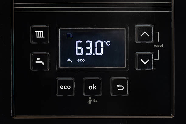 istock Control panel with display of the working gas boiler for hot water and heating. The smart control panel household gas boiler, close up. 2249713889