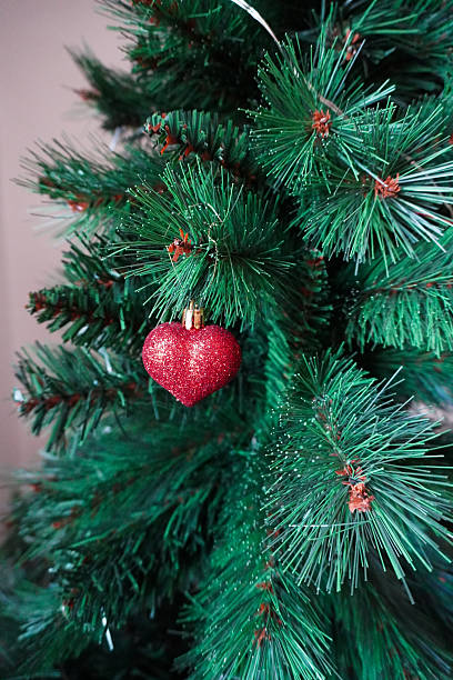 istock Christmas decor. Christmas tree. Heart shaped decoration. Xmas holiday pattern. Greeting card. Xmas Background design. Invitation, greeting banner. Christmas and New Year celebration. 2249714299