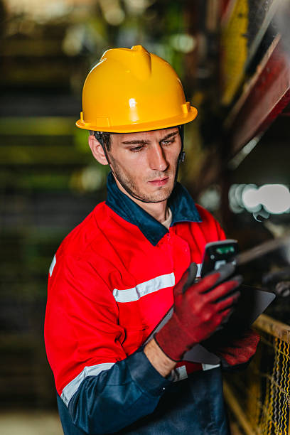 istock Technician Using Barcode Scanner and Tablet to Manage Auto Parts Inventory in Warehouse 2249716493