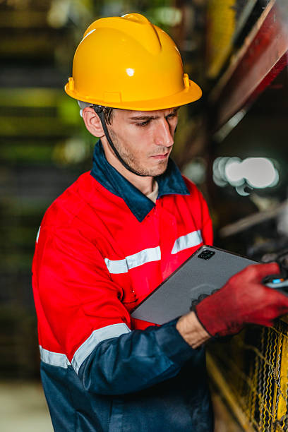 istock Technician Using Barcode Scanner and Tablet to Manage Auto Parts Inventory in Warehouse 2249717703