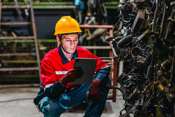 istock Technician Using Barcode Scanner and Tablet to Manage Auto Parts Inventory in Warehouse 2249717808