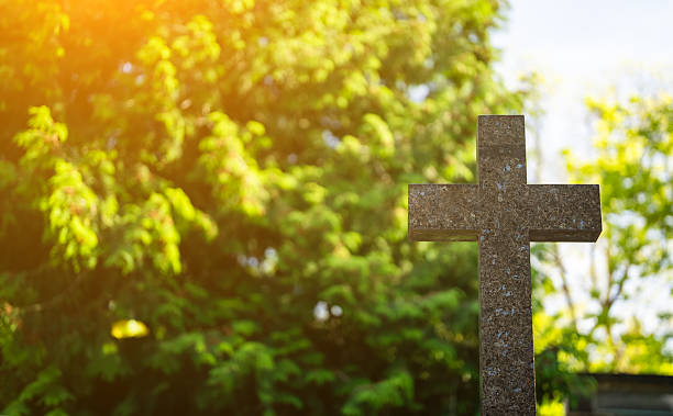 Memorial stone cross in the forest cemetery.