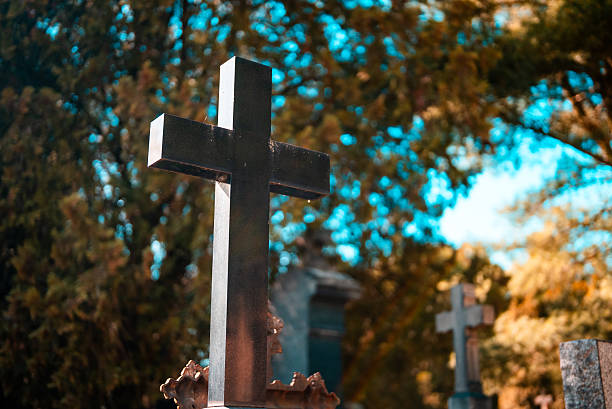 Memorial stone cross in the forest cemetery.