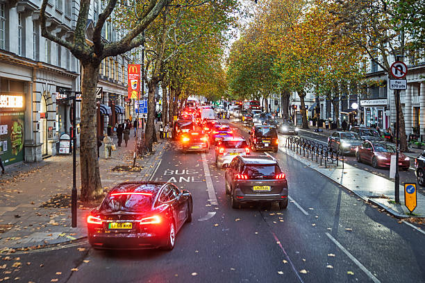 Kingsway, London, England, United Kingdom, Europe - November 8th 2025: Dense afternoon traffic seen from the top floor of an English double‑decker bus on an autumn day.