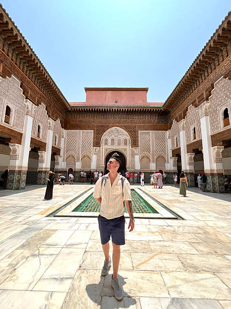 White caucasian young latin adult tourist male exploring Marrakech souk, Morocco, Africa.