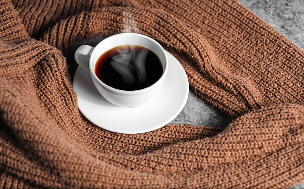 istock Winter coffee cup on Cozy knit shirt 2249723177