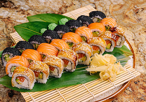 Beautifully arranged sushi platter with colorful rolls and garnishes