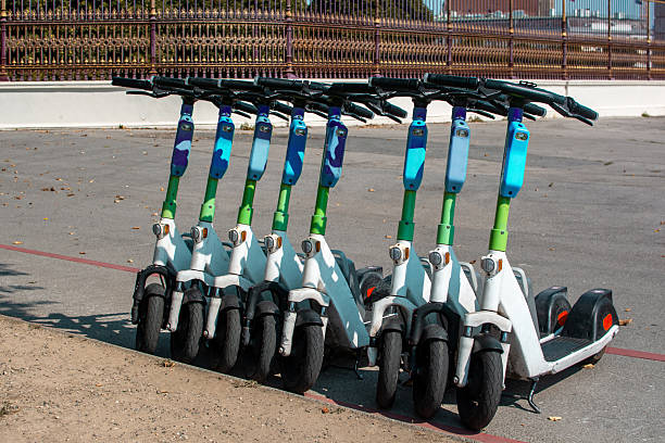 istock Shared E-Scooters Lined Up in a Public Park Area in Vienna 2249723944