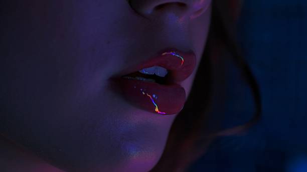 istock Close Up of Lips with Colorful Reflections 2249724114