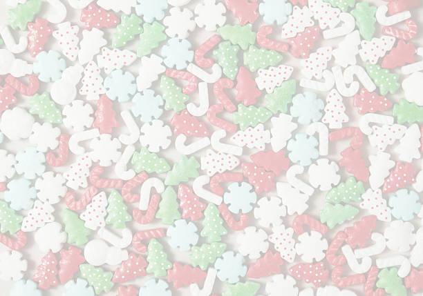 Soft, faded Christmas candy shape trees, stars, snowmen - creating a gentle full-frame holiday background. Ideal for kids themes, festive wallpapers, packaging, crafts, and text overlays