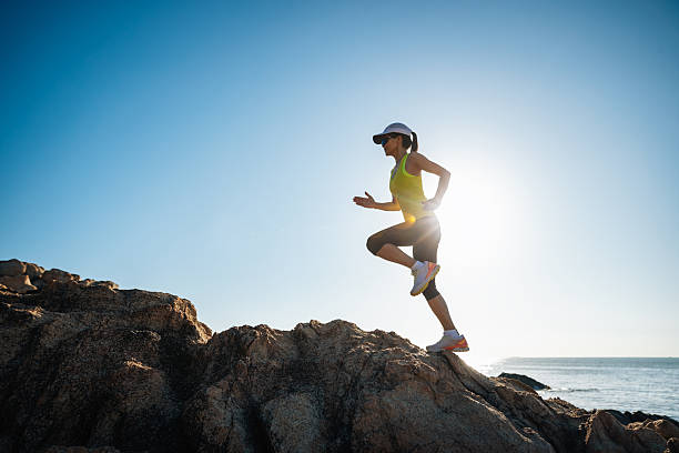 istock Fitness woman runner running on seaside bridge 2249724804