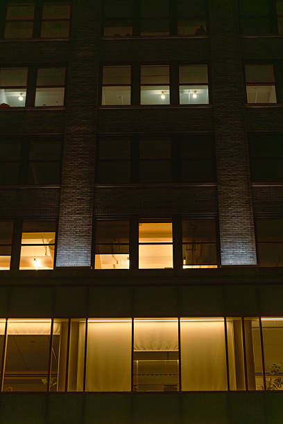 istock Building Exterior at Night with Warm Interior Lighting 2249725966