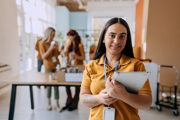 istock Female volunteer posing for camera 2249731615