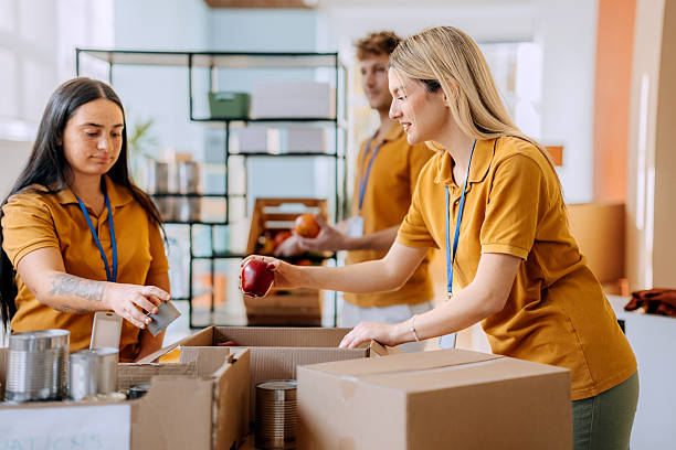 istock Young volunteers packing boxes indoors 2249731800
