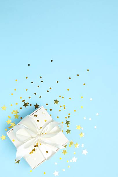 istock Beautiful gift box tied with bow on blue background 2249735051