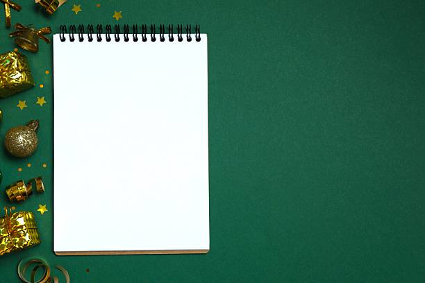 Blank notepad festive Christmas decorations, perfect for planning holidays and New Year's resolutions in a cozy holiday setting