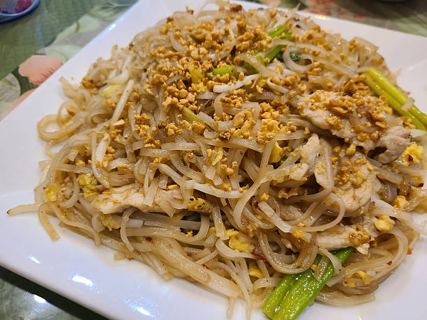 istock Asian Chicken Noodle Dish with Peanuts and Scallions Close-Up 2249736608