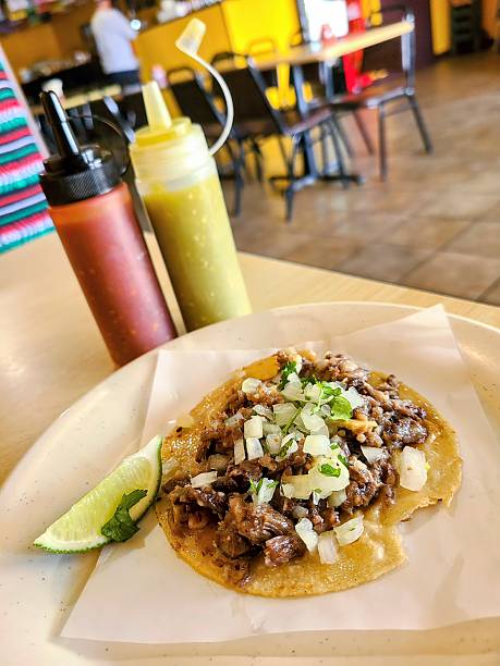 Authentic Mexican Taco with Lime and Sauces, Casual Dining Setting