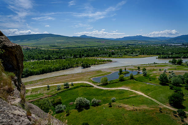 istock Riverbank fields and mountains seen from Uplistsikhe rock cliffs 2249738413