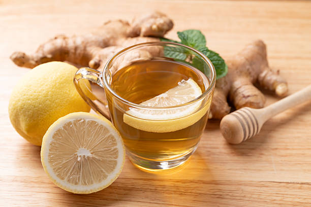istock Lemon and ginger tea in cup glass with mint leaf 2249740491