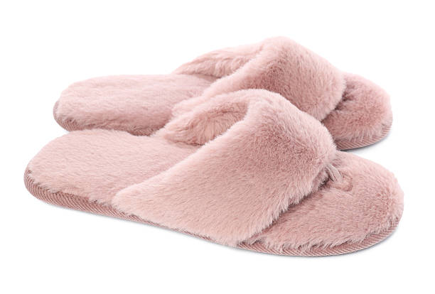 istock Pair of pink soft slippers isolated on white 2249740831