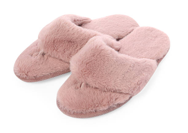 istock Pair of pink soft slippers isolated on white 2249740850