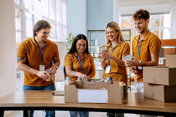 istock Young volunteers packing boxes indoors 2249740869