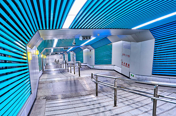 Optics Valley Square Station serves as a major interchange hub within Wuhan's metro network, distinguished by the following key features:‌Vast Circular Concourse‌: As Wuhan's first station featuring a 360-degree circular design, its concourse spans an expansive 31,400 square metres, earning recognition as one of Asia's largest underground stations.‌‌Distinctive directional signage:‌ The station employs an innovative circular angle indicator system to guide passengers towards exits, replacing conventional ‘left turn’ or ‘right turn’ prompts.‌‌Cultural-themed decoration: The concourse is adorned with motifs inspired by the Five Elements of traditional Chinese culture – Metal, Wood, Water, Fire, and Earth – distinguished by five distinct colours, creating a unique visual experience.‌‌Crucial interchange function: Serving as a transfer point for Lines 2 and 11 (with future plans for Line 9), the station connects Wuhan's Optics Valley district with the wider city.
