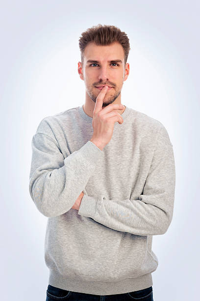 istock Studio portrait of confident young man standing against isolated white background with copy space 2249744757