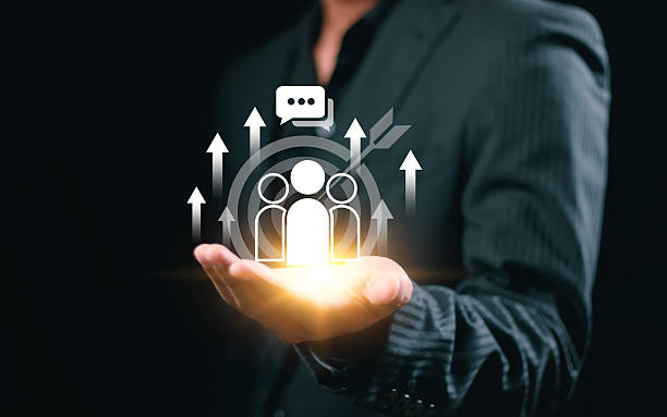 istock Businessman holding virtual target customer icon for customer focus group and Targeting customer concept. Digital marketing online, CRM, Data exchanges development and customer service. 2249747458
