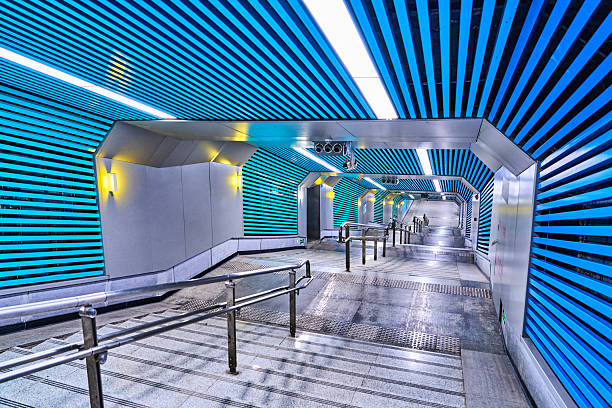 Optics Valley Square Station serves as a major interchange hub within Wuhan's metro network, distinguished by the following key features:‌Vast Circular Concourse‌: As Wuhan's first station featuring a 360-degree circular design, its concourse spans an expansive 31,400 square metres, earning recognition as one of Asia's largest underground stations.‌‌Distinctive directional signage:‌ The station employs an innovative circular angle indicator system to guide passengers towards exits, replacing conventional ‘left turn’ or ‘right turn’ prompts.‌‌Cultural-themed decoration: The concourse is adorned with motifs inspired by the Five Elements of traditional Chinese culture – Metal, Wood, Water, Fire, and Earth – distinguished by five distinct colours, creating a unique visual experience.‌‌Crucial interchange function: Serving as a transfer point for Lines 2 and 11 (with future plans for Line 9), the station connects Wuhan's Optics Valley district with the wider city.