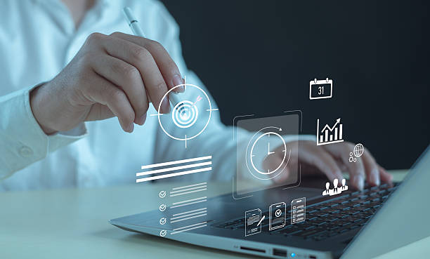 istock business professional using digital tools on laptop to manage goals, time, productivity, showcasing modern technology, data-driven planning, efficient workflow in today's smart work environment. 2249748410