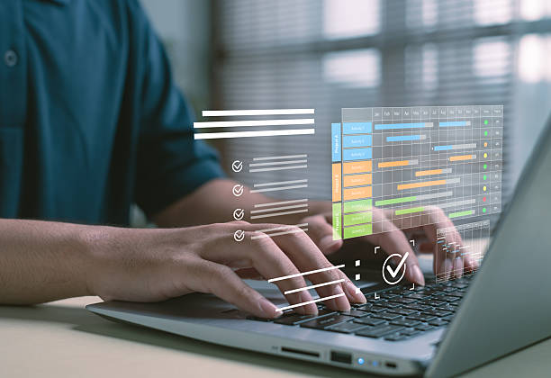 istock digital project planning concept showing interactive Gantt charts and task tracking on laptop, illustrating workflow management, productivity, modern business scheduling in a professional environment. 2249748439