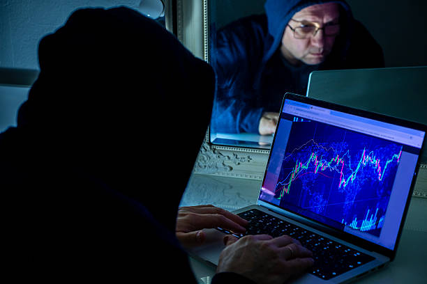 istock A man in the dark uses a laptop, trading cryptocurrency. Cryptocurrency scam. 2249749032
