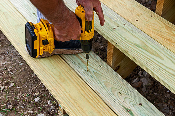 istock Screwing down treads on wooden steps 2249752226