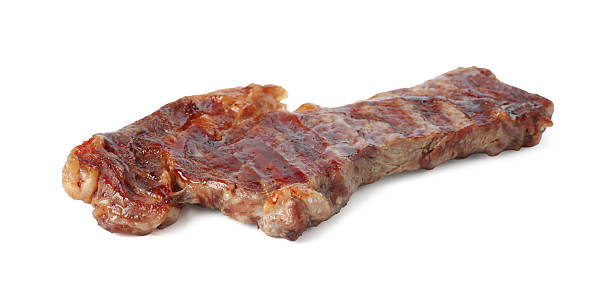 istock Piece of delicious grilled beef meat isolated on white 2249756442