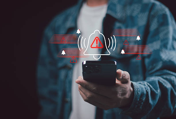 istock Corporate man handling emergency alert notification on mobile phone, concept of warning message, cyber threat monitoring, digital security breach, urgent system error, and risk management 2249757221