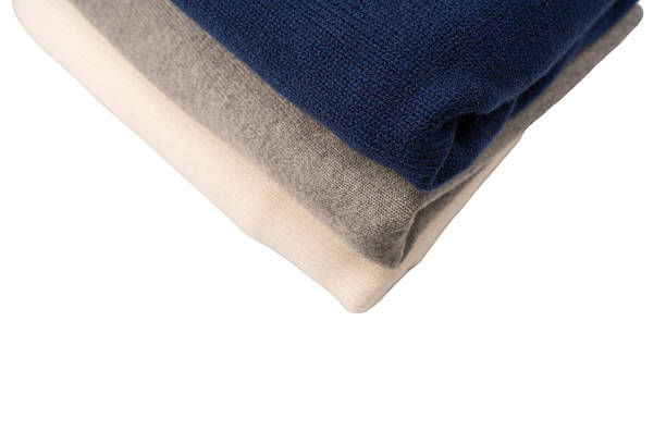 istock A group of warm sweaters isolated on a white background. 2249758571