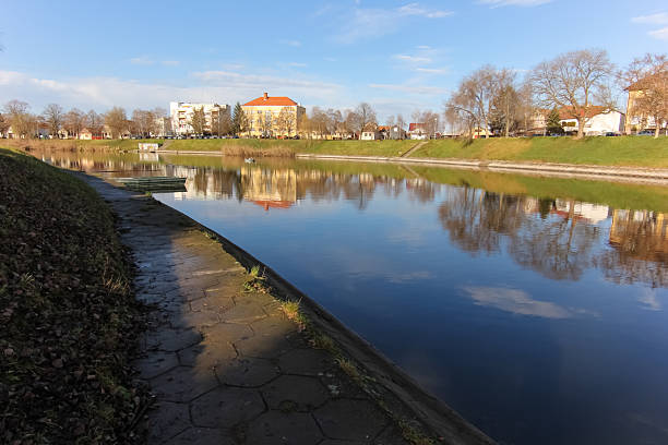 istock Bosut River Reflection Surrounded by Rural Buildings and Trees, Vinkovci, Croatia 2249759396