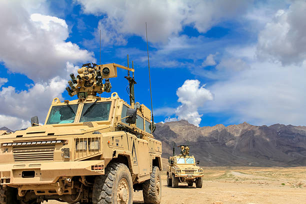 istock Military Vehicles on Patrol in a Desert Terrain for Security Operations 2249764942