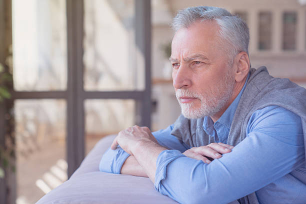 istock Sad pensive lonely caucasian old elderly senior man grandfather having problem, the lack of family communication, loneliness. Old man left alone at home, no visitors. 2249765297