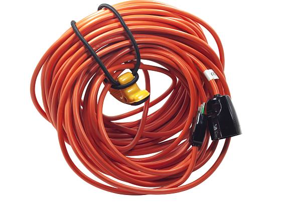 istock Coiled orange extension cord providing electrical power distribution 2249765677