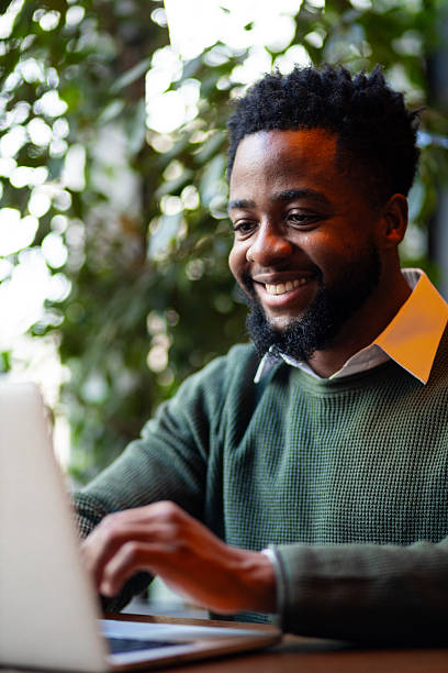 istock Young man typing on laptop indoors 2249765976