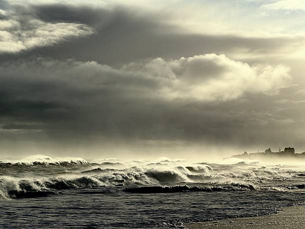 Breaking waves on a beach in Northumberland on a windy day